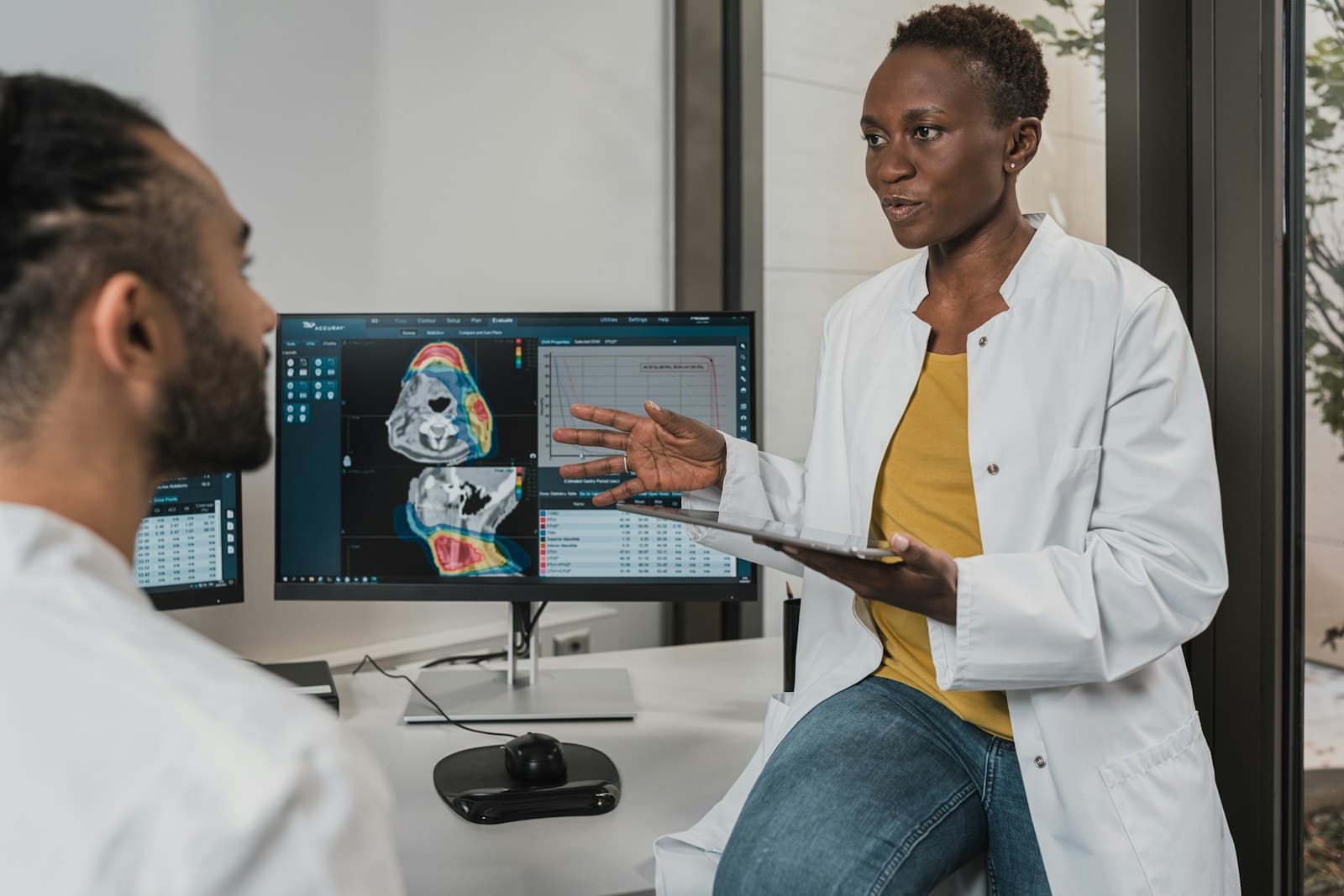 Two clinicians reviewing results together in a modern Australian practice